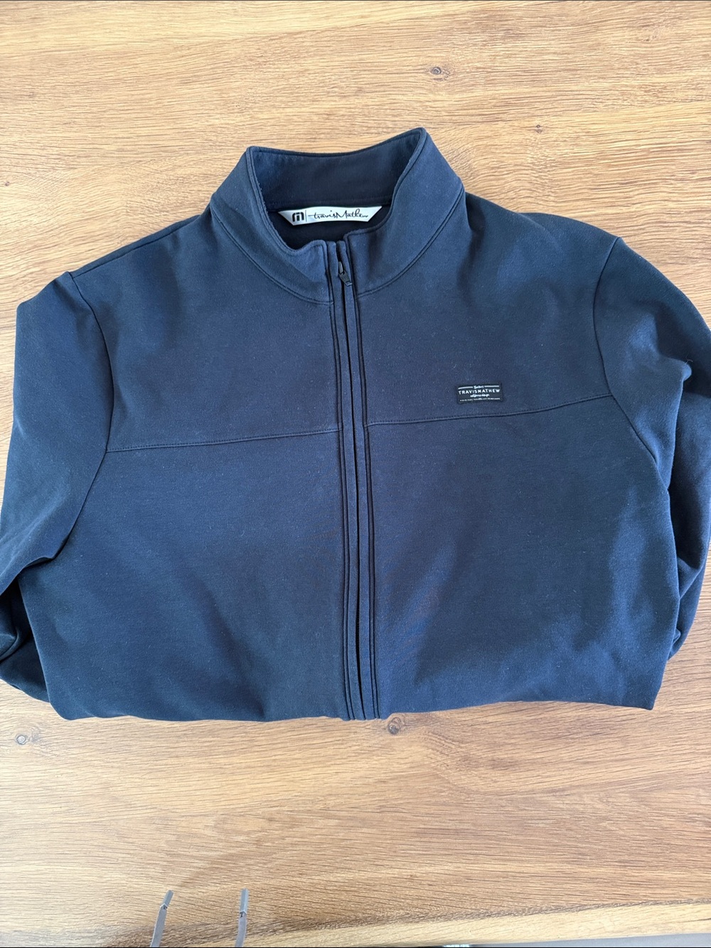 Travis Mathew men’s size large full zip black fleece.